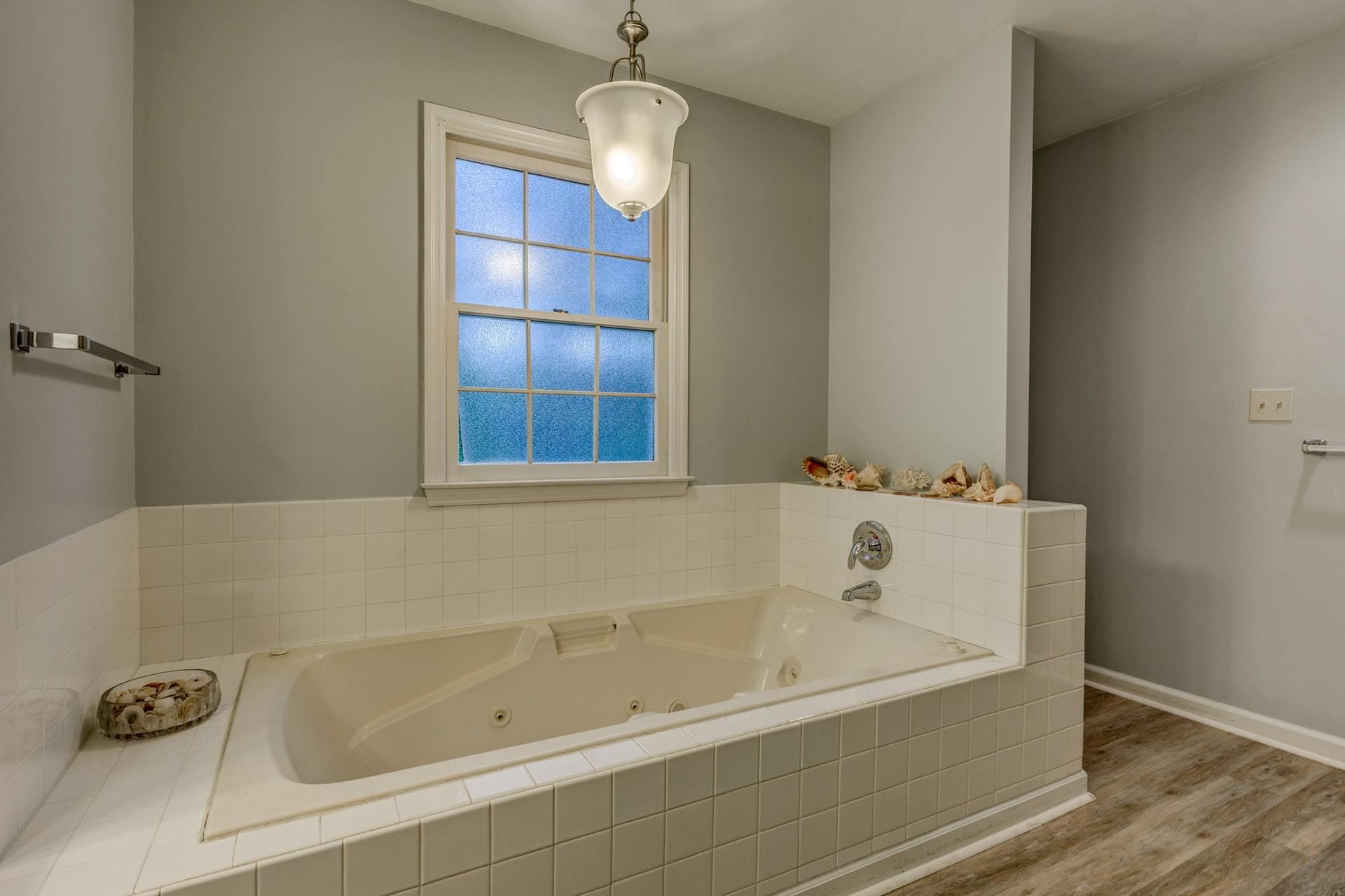 366 Stonehaven Lane Blue Ridge, VA 24064 - Photo 22 of 37 a white bath tub sitting next to a window