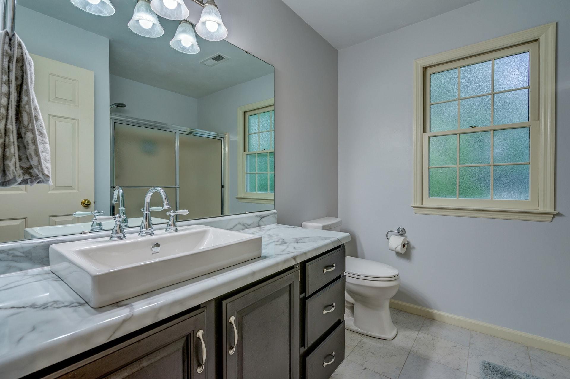 366 Stonehaven Lane Blue Ridge, VA 24064 - Photo 23 of 37 a bathroom with a granite countertop sink a toilet and a mirror