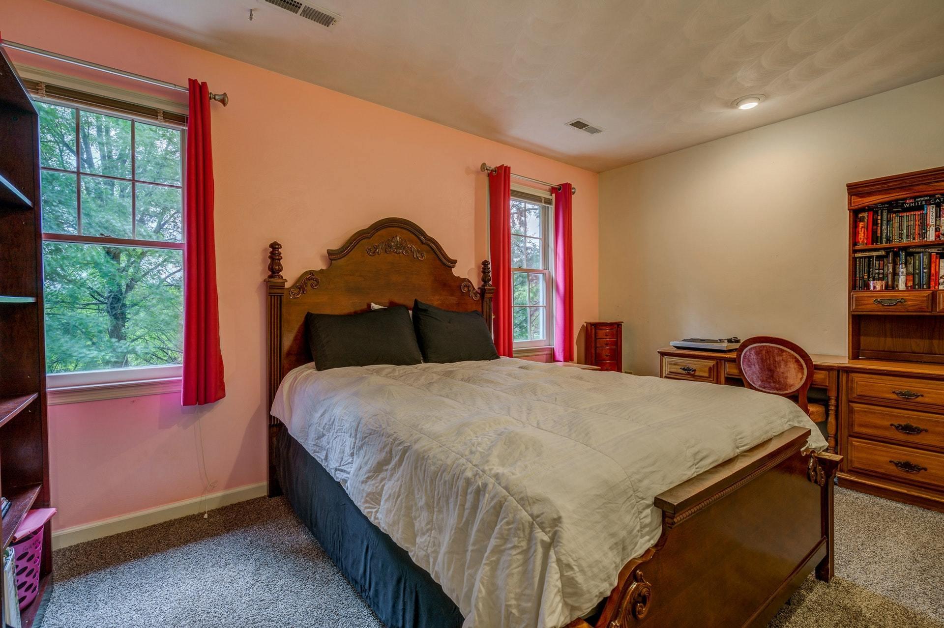 366 Stonehaven Lane Blue Ridge, VA 24064 - Photo 25 of 37 a bedroom with a bed and a dresser next to a window