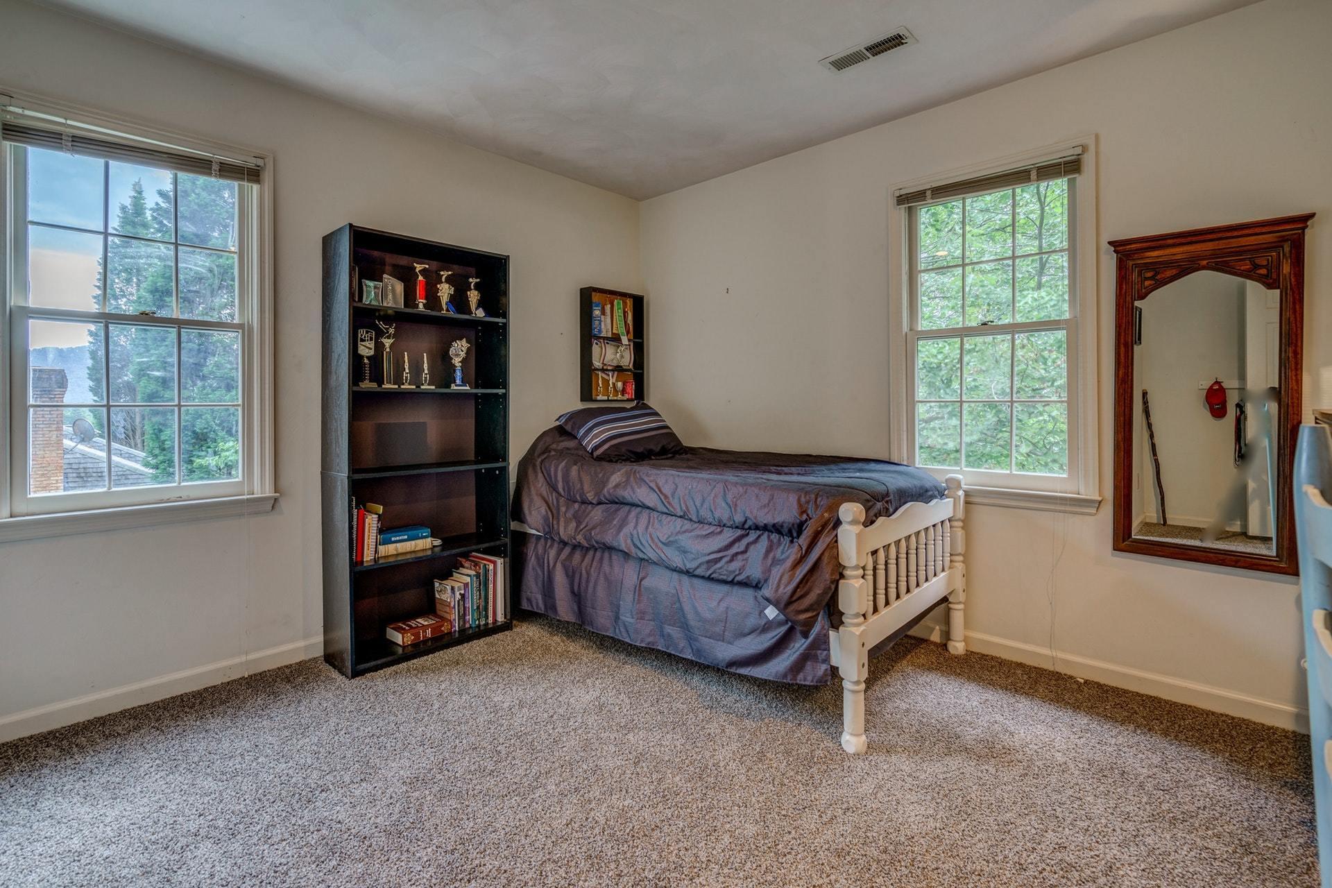 366 Stonehaven Lane Blue Ridge, VA 24064 - Photo 26 of 37 a bedroom with a bed and a window