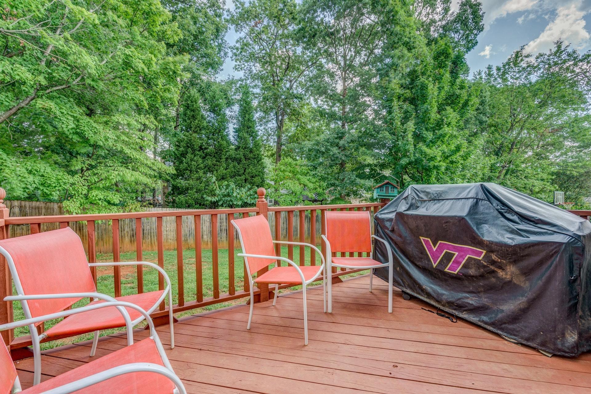 366 Stonehaven Lane Blue Ridge, VA 24064 - Photo 31 of 37 an outdoor sitting area with furniture and wooden floor