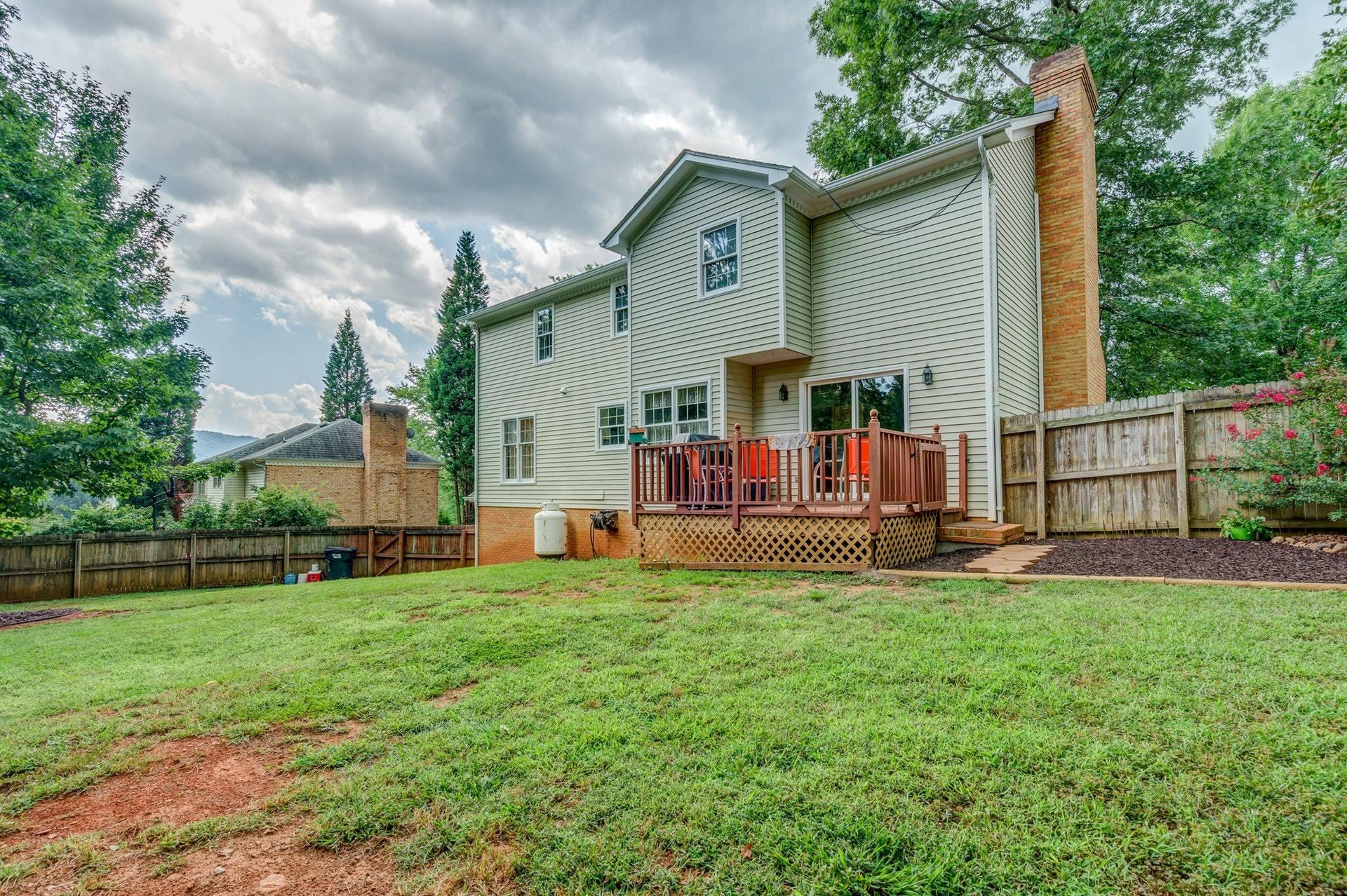 366 Stonehaven Lane Blue Ridge, VA 24064 - Photo 33 of 37 a view of a house with a yard and sitting area