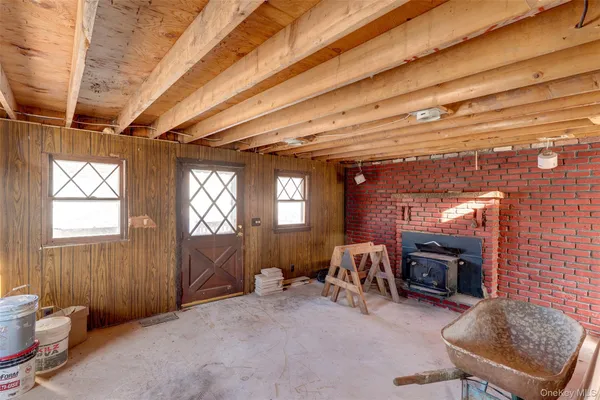a view of a livingroom with furniture and a fireplace