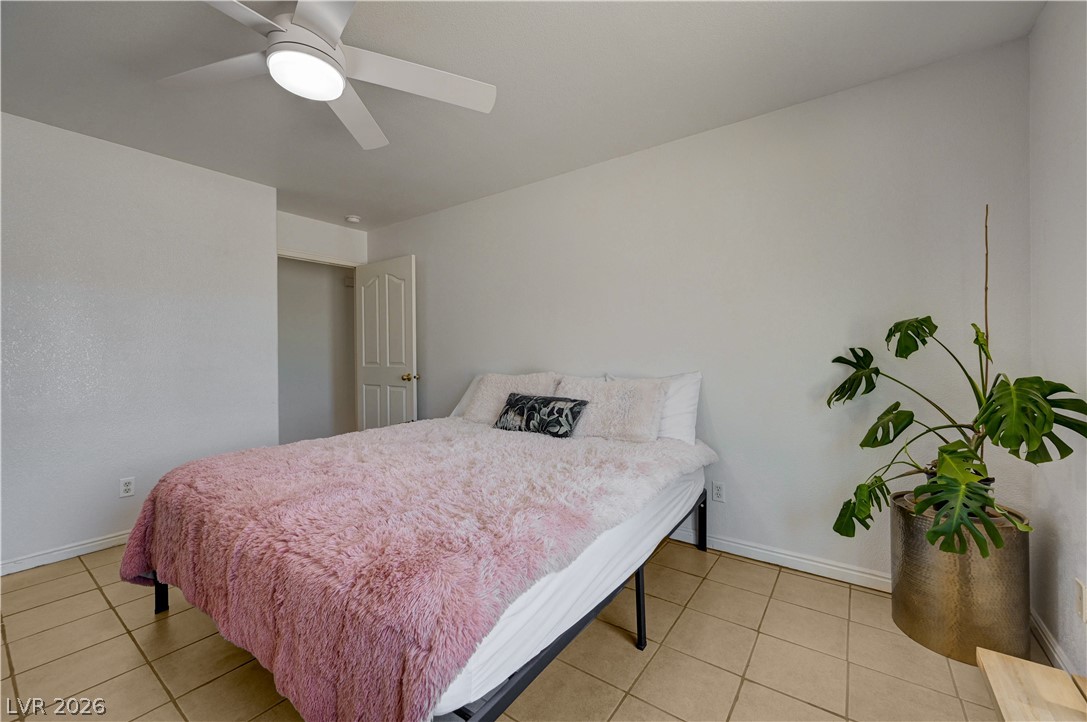 1272 Liston Avenue Logandale, NV 89021 - Photo 35 of 61 A comfortable bedroom with a cooling ceiling fan and durable tile flooring awaits.