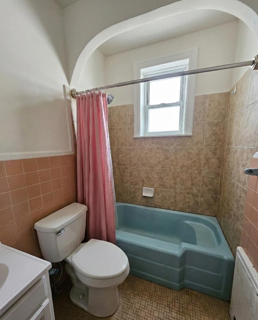 155 Front Street, Unit 3 Secaucus, NJ 07094 - Photo 11 of 27 a bathroom with a toilet and a bath tub