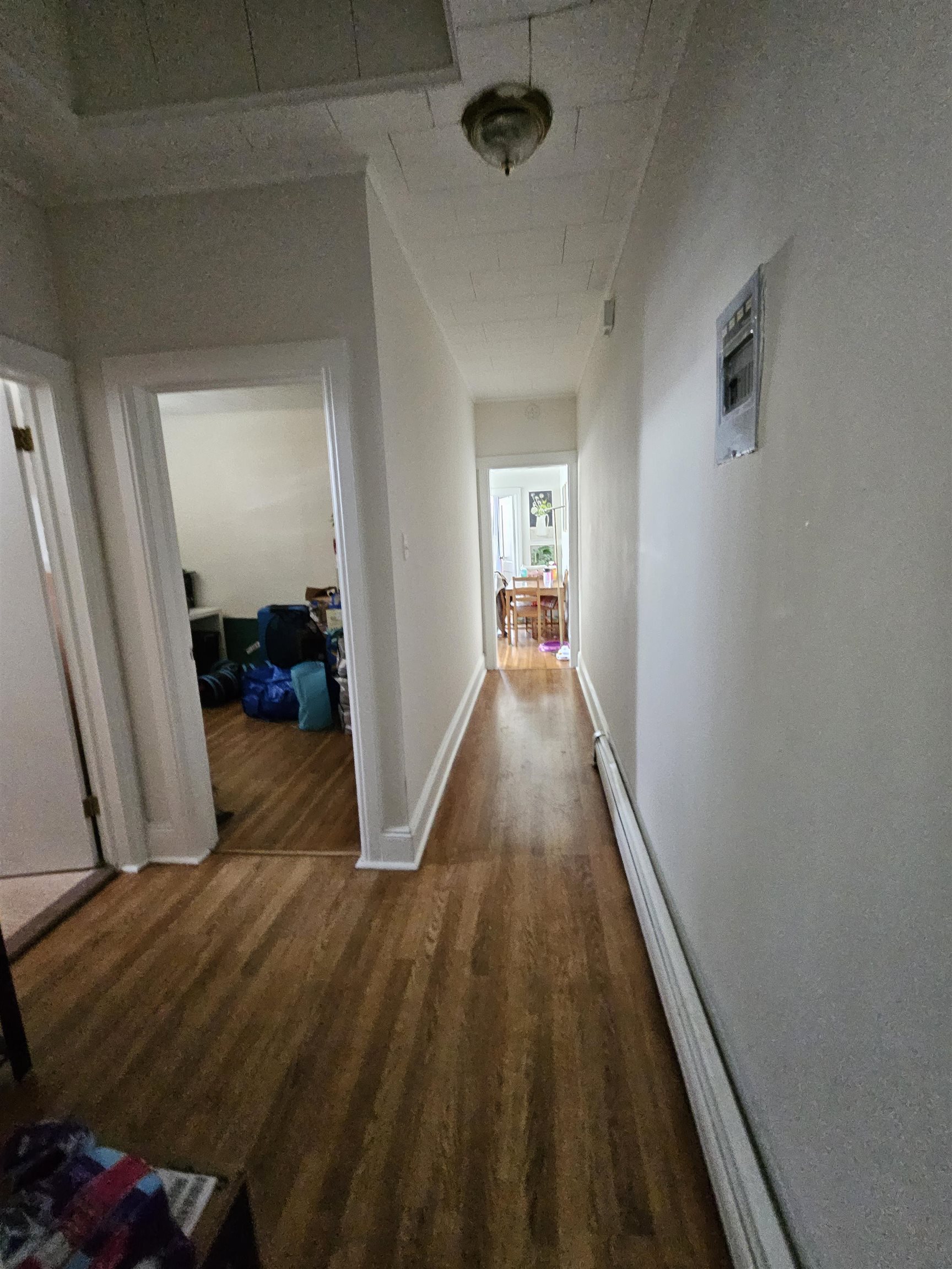 155 Front Street, Unit 3 Secaucus, NJ 07094 - Photo 13 of 27 a view of a hallway with wooden floor and staircase