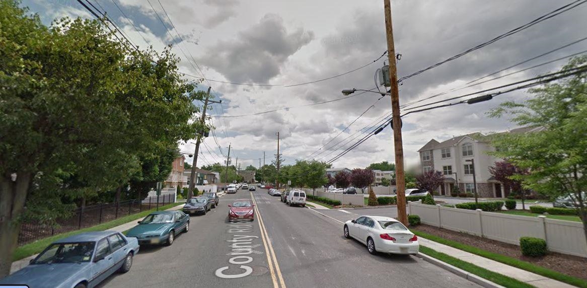 155 Front Street, Unit 2 Secaucus, NJ 07094 - Photo 14 of 19 a city street lined with parked cars and buildings