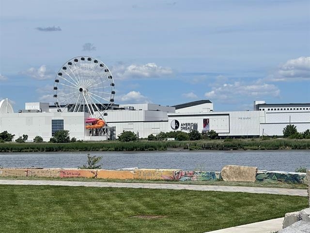 155 Front Street, Unit 2 Secaucus, NJ 07094 - Photo 17 of 19 an aerial view of a house with a garden and lake view