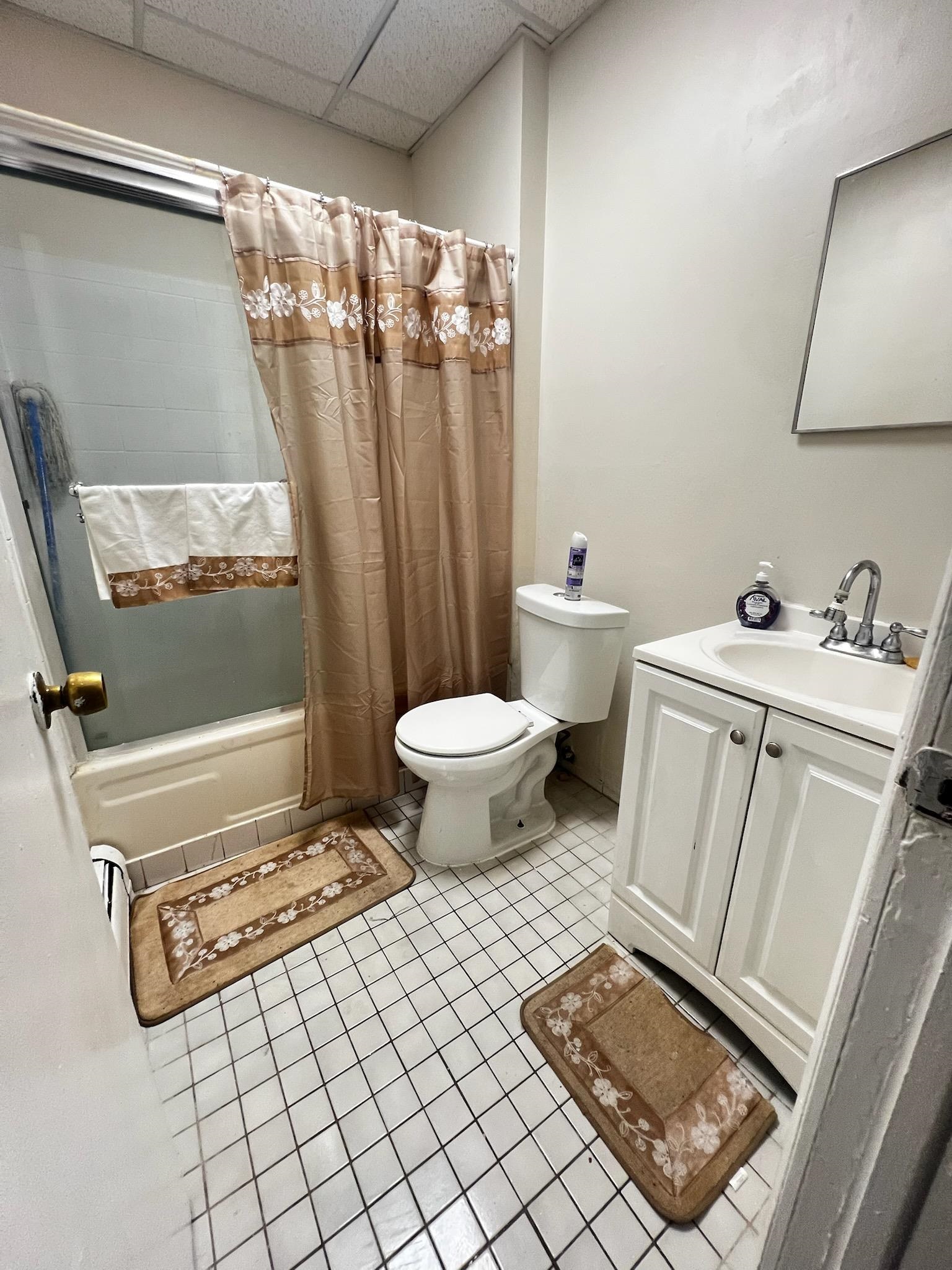 155 Front Street, Unit 2 Secaucus, NJ 07094 - Photo 4 of 19 a bathroom with a sink toilet and shower