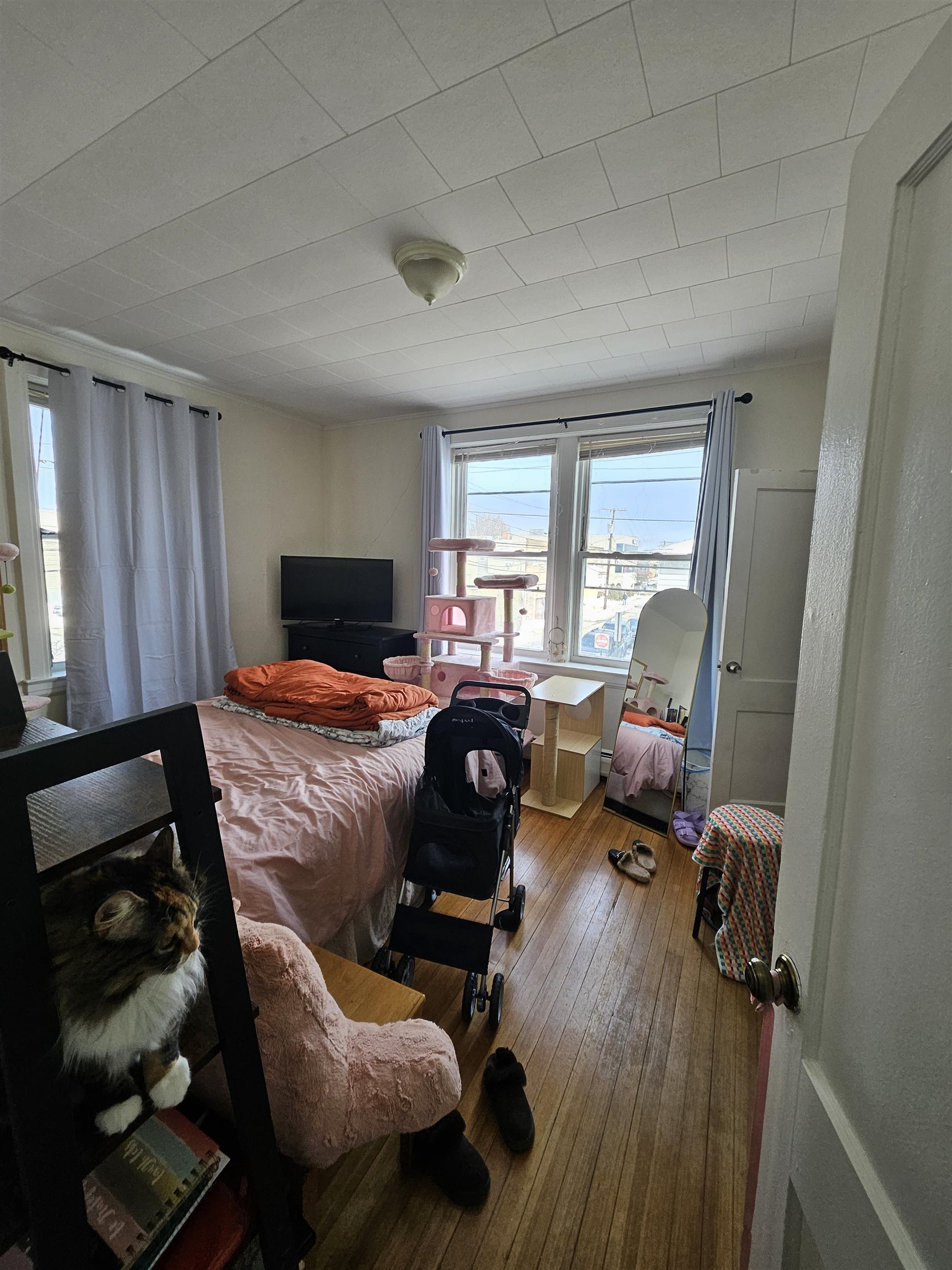 155 Front Street, Unit 3 Secaucus, NJ 07094 - Photo 8 of 27 a bedroom with furniture and a window