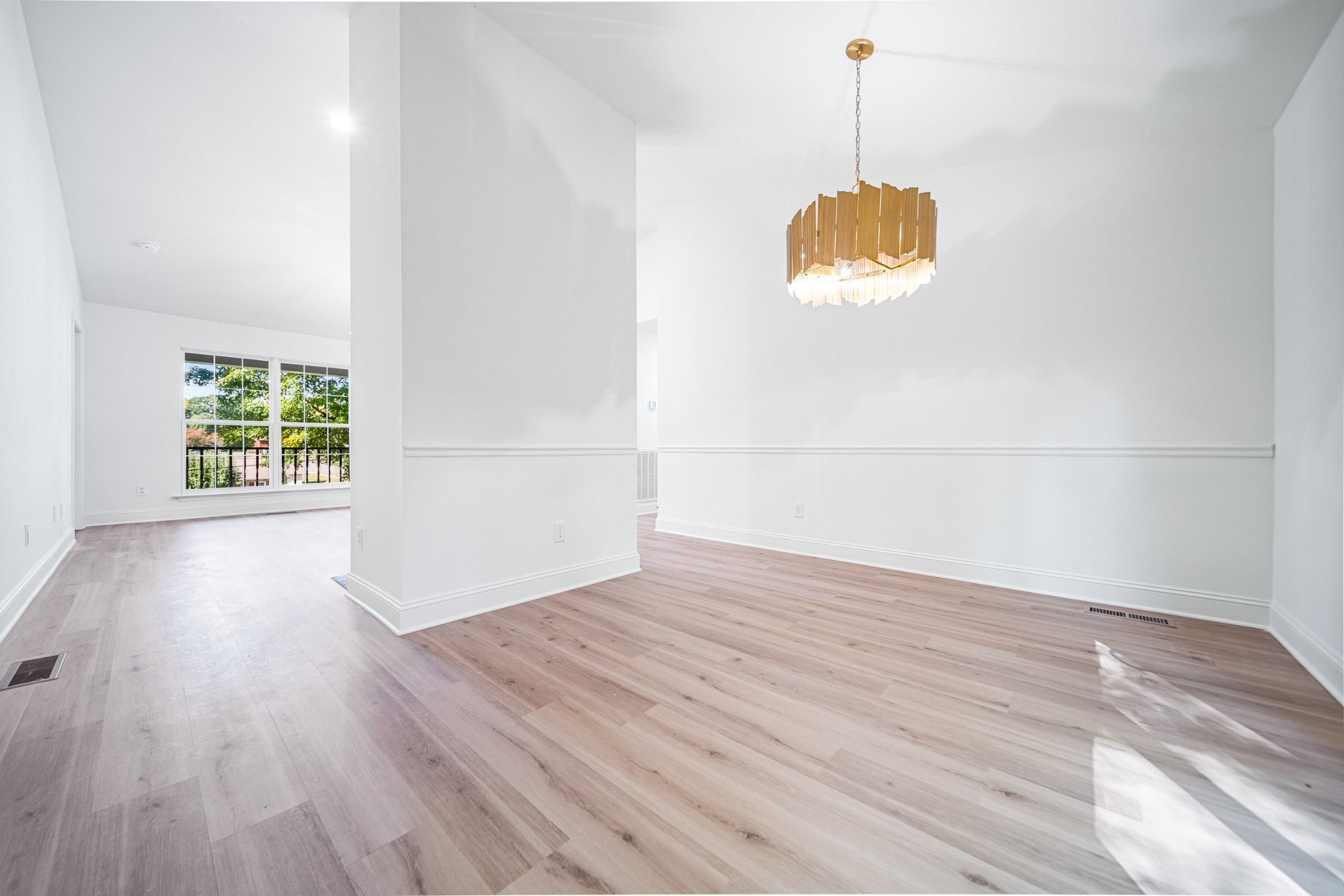 812 Hunters Crossing Lane Springfield, TN 37172 - Photo 11 of 39 a view of an empty room with wooden floor and a window