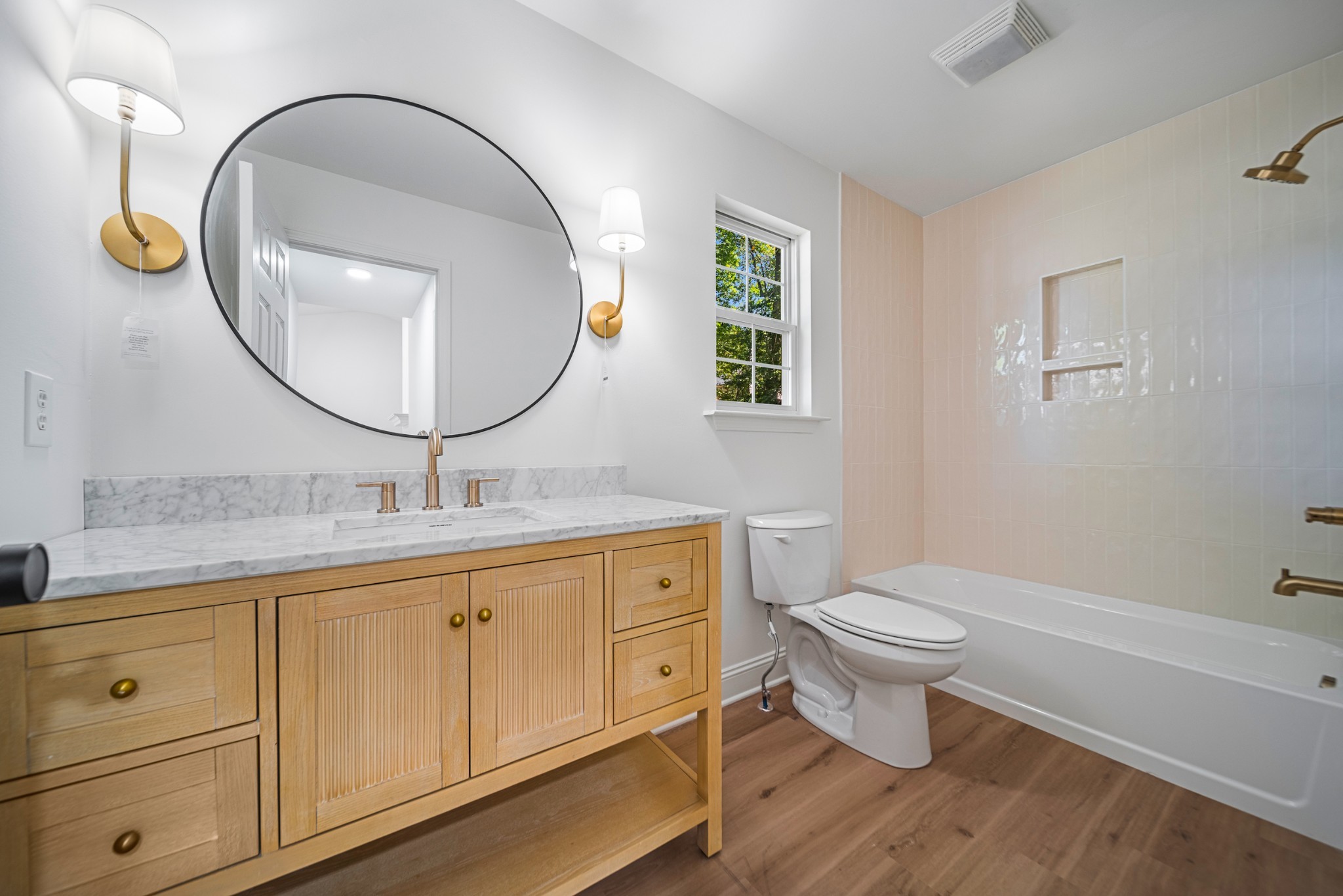 812 Hunters Crossing Lane Springfield, TN 37172 - Photo 22 of 39 a bathroom with a toilet a sink a mirror and bathtub