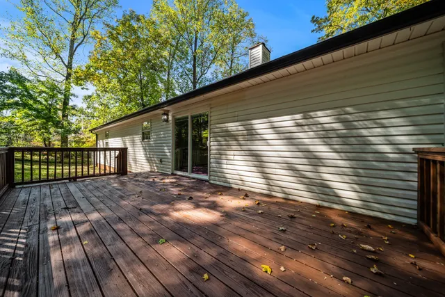 a view of backyard with wooden deck