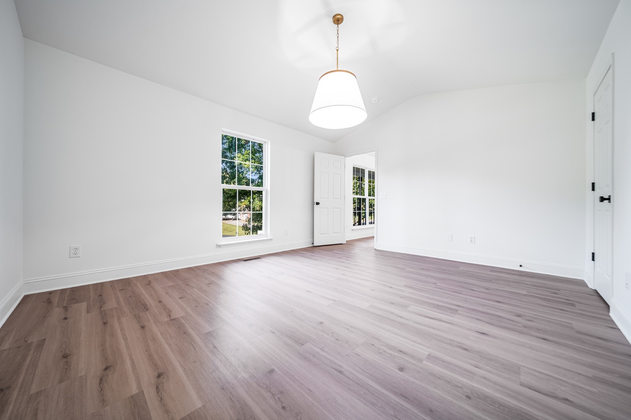 812 Hunters Crossing Lane Springfield, TN 37172 - Photo 6 of 39 a view of an empty room with wooden floor and a window