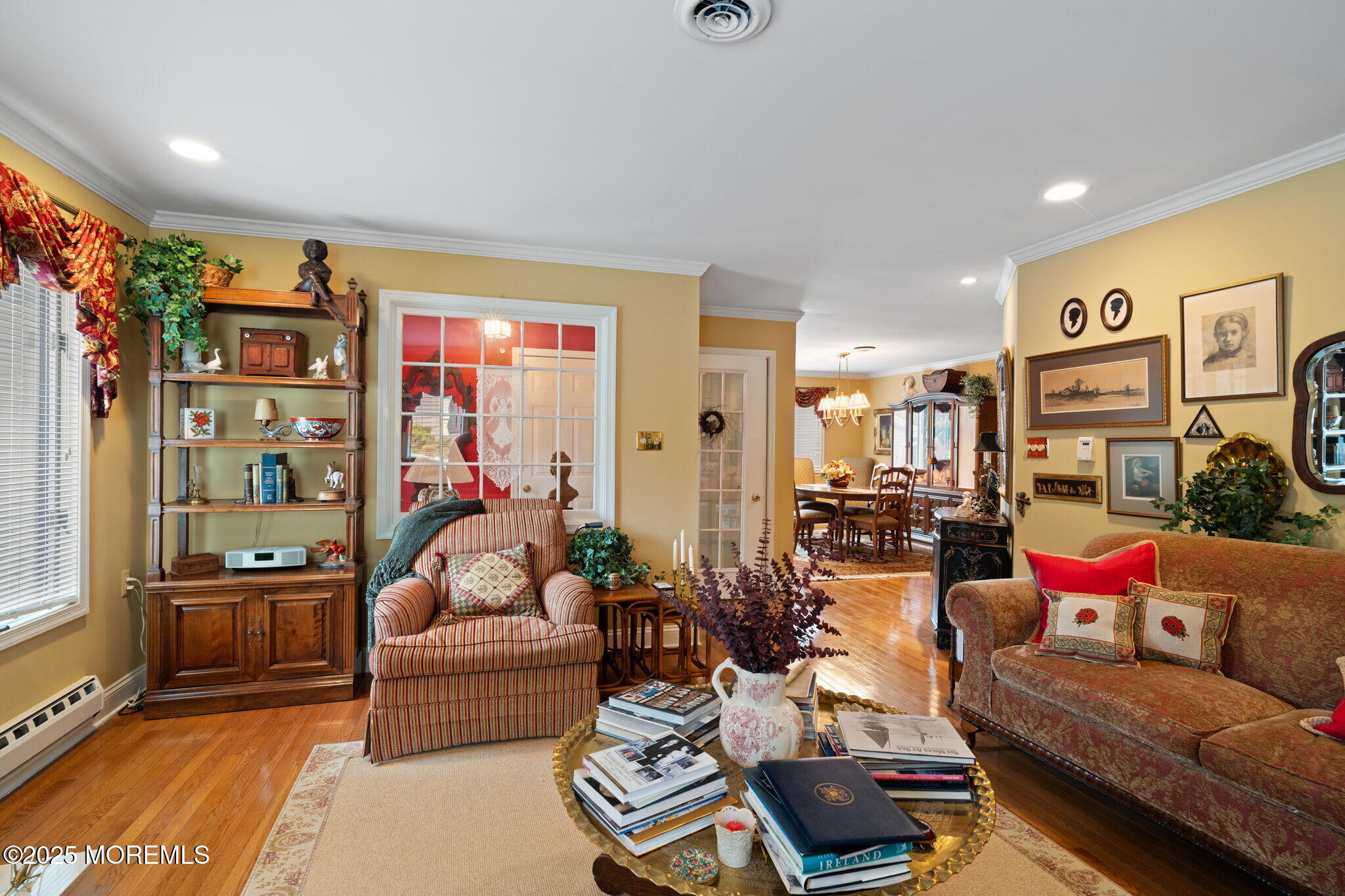 87 Ash Road, Unit 2 Manahawkin, NJ 08050 - Photo 11 of 27 a living room with furniture and a flat screen tv