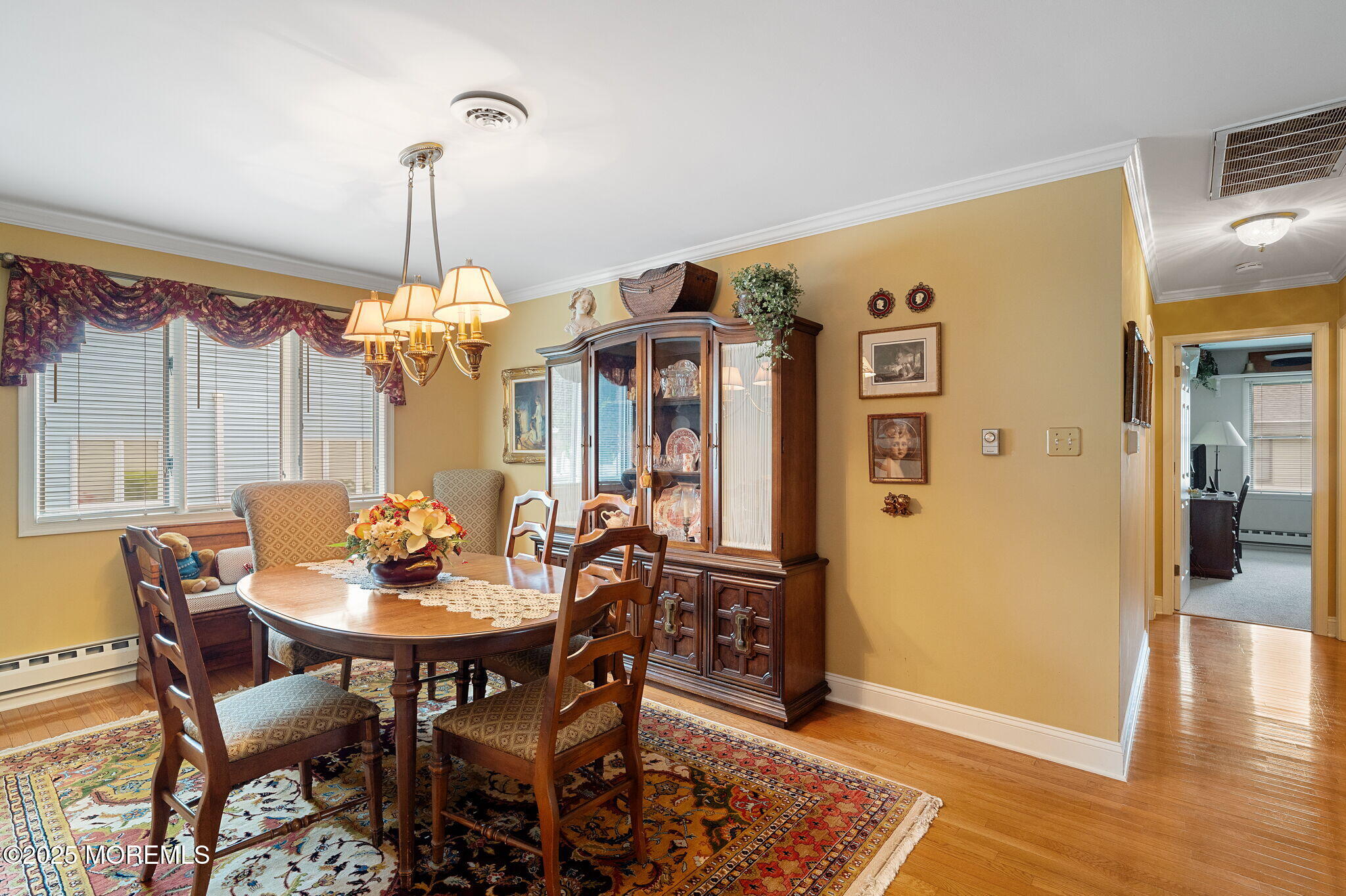 87 Ash Road, Unit 2 Manahawkin, NJ 08050 - Photo 13 of 27 a view of a dining room with furniture window and wooden floor