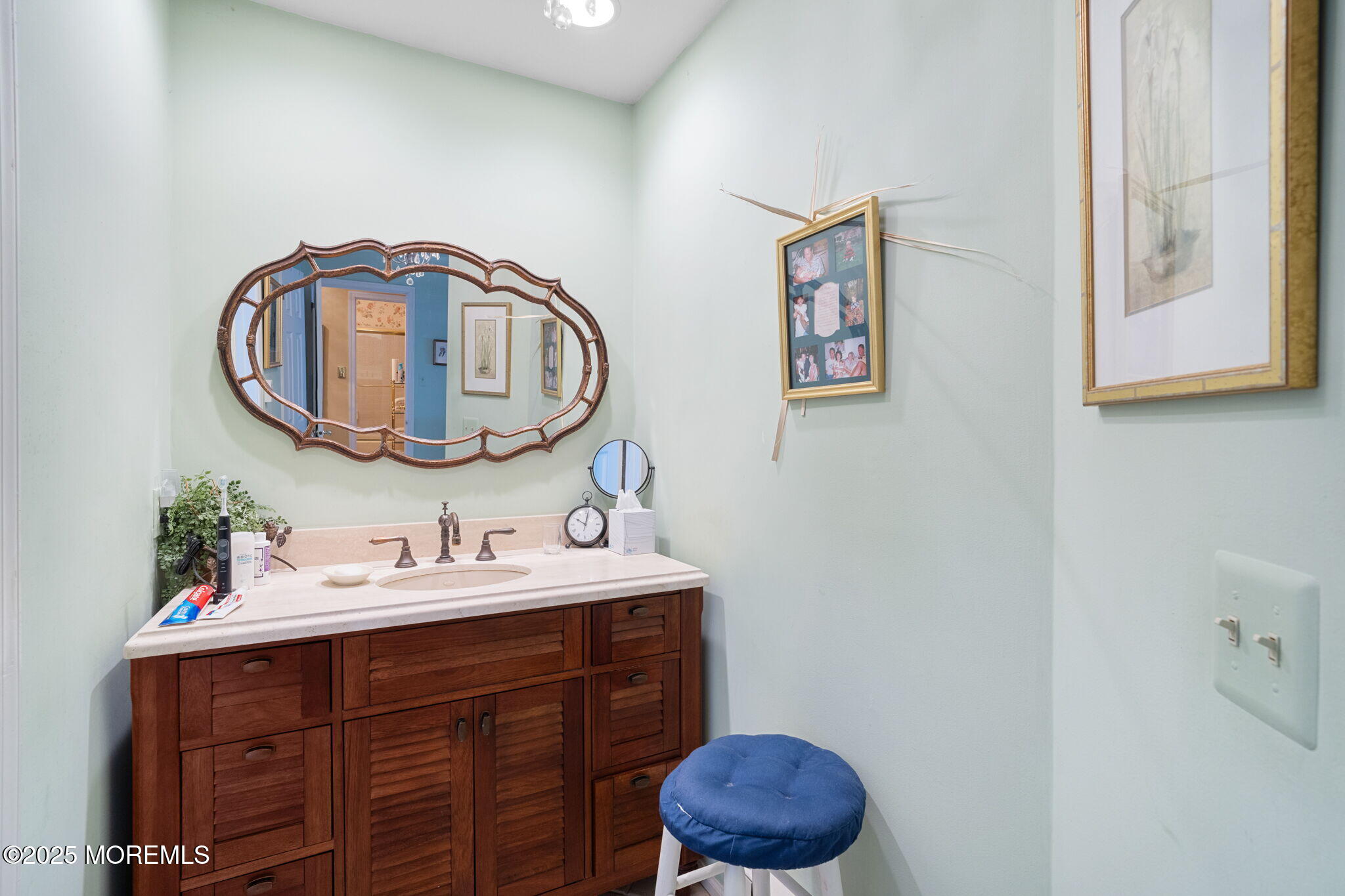 87 Ash Road, Unit 2 Manahawkin, NJ 08050 - Photo 23 of 27 a bathroom with a sink and a mirror