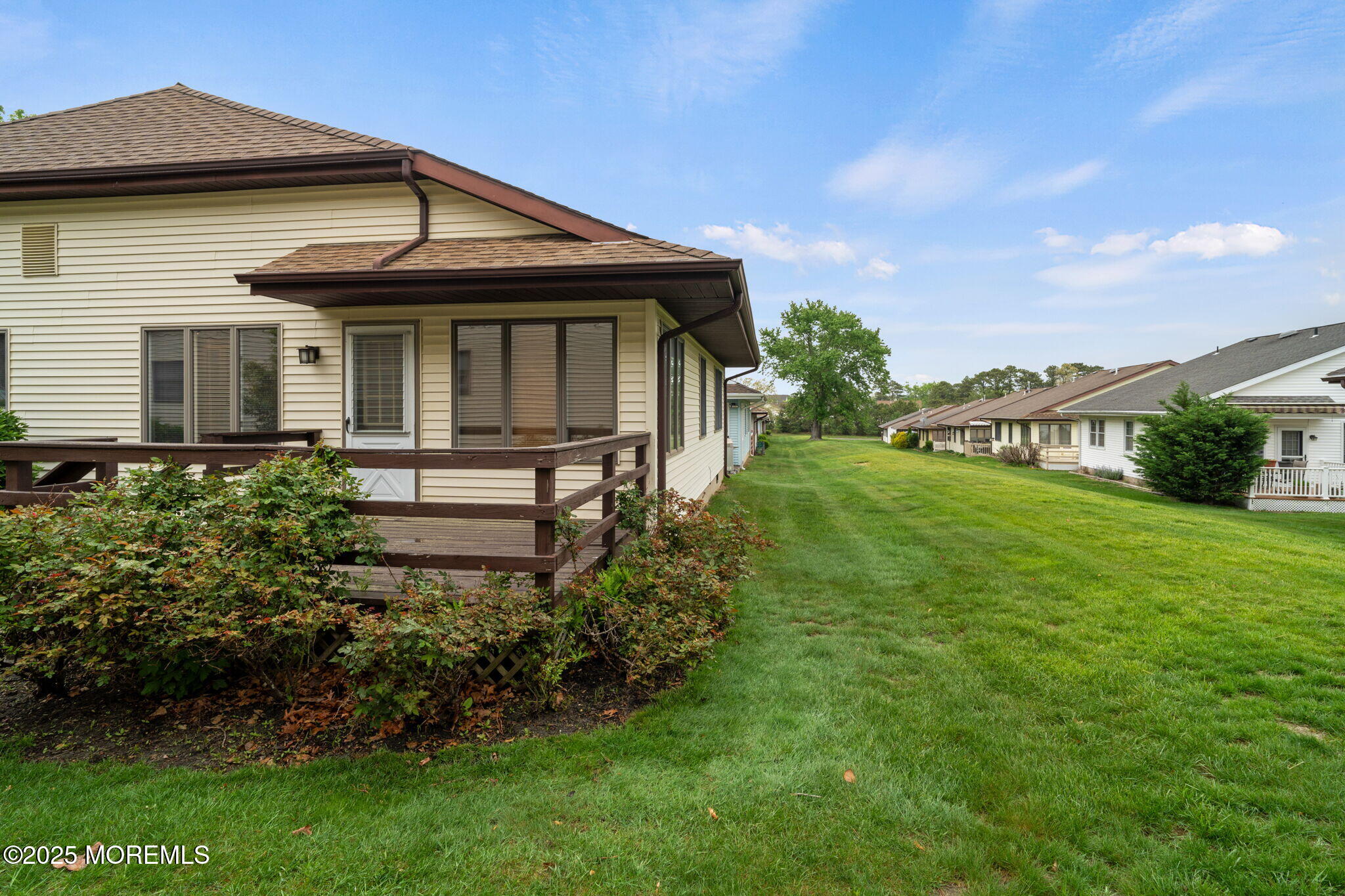 87 Ash Road, Unit 2 Manahawkin, NJ 08050 - Photo 27 of 27 a front view of a house with garden
