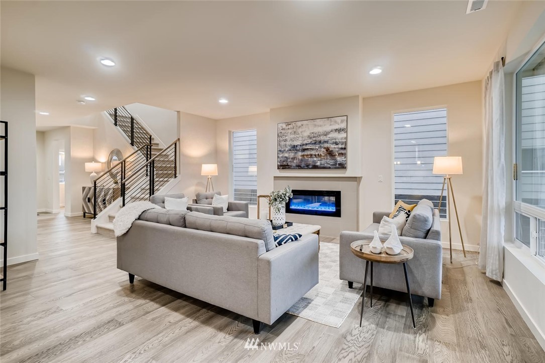 4322 232nd Place Southeast, Unit 5 Bothell, WA 98021 - Photo 23 of 31 a living room with furniture and a fireplace