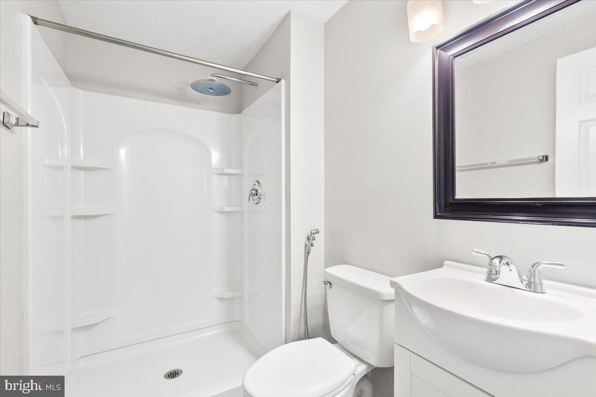 1489 Eden Drive Frederick, MD 21701 - Photo 20 of 43 a bathroom with a sink toilet and shower