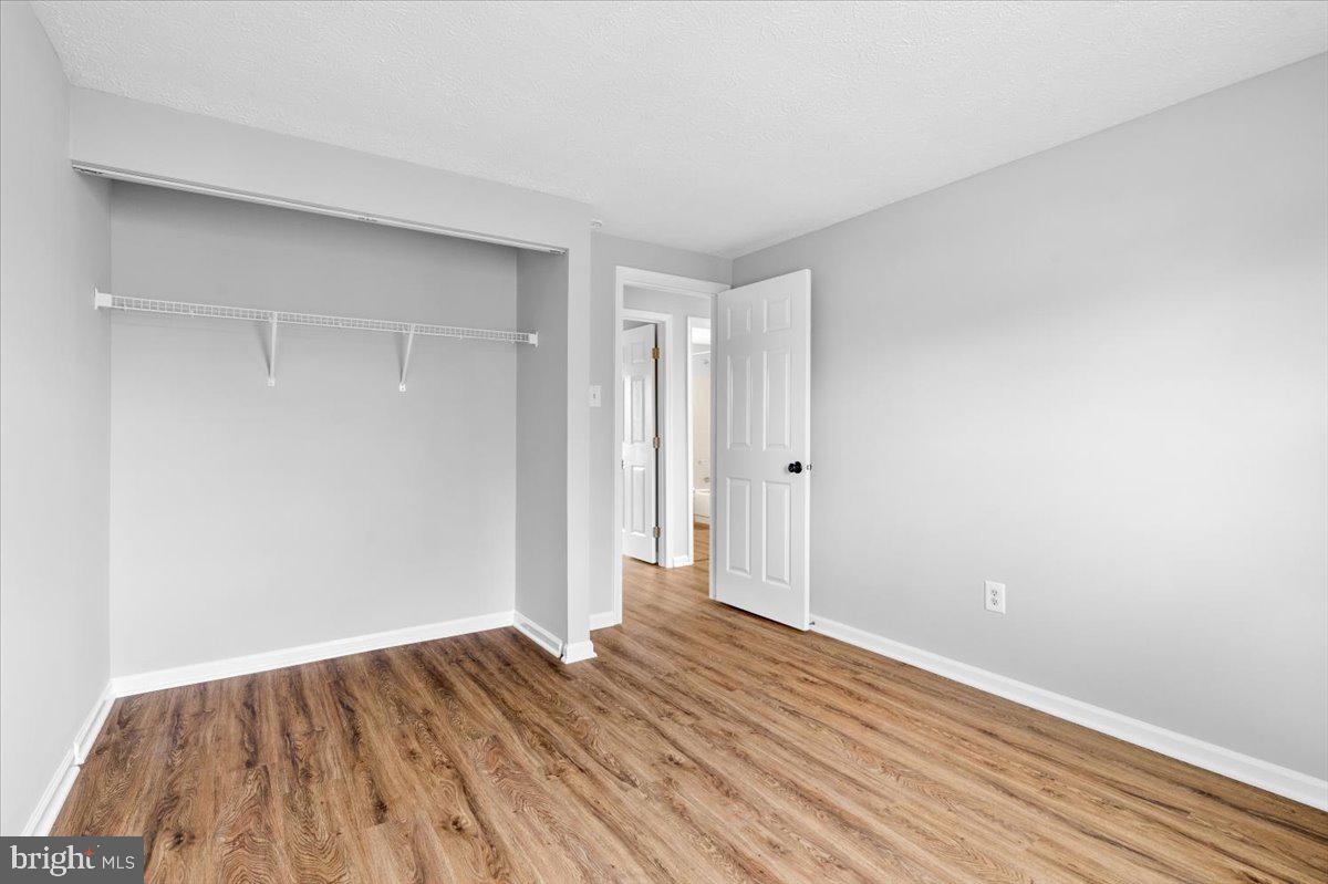 1489 Eden Drive Frederick, MD 21701 - Photo 22 of 43 a view of an empty room with wooden floor