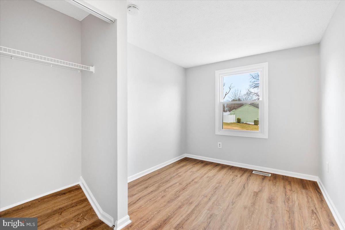 1489 Eden Drive Frederick, MD 21701 - Photo 24 of 43 a view of an empty room with wooden floor and a window