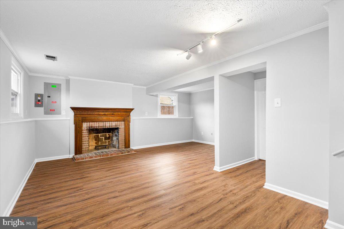 1489 Eden Drive Frederick, MD 21701 - Photo 28 of 43 a view of an empty room with wooden floor fireplace and a window