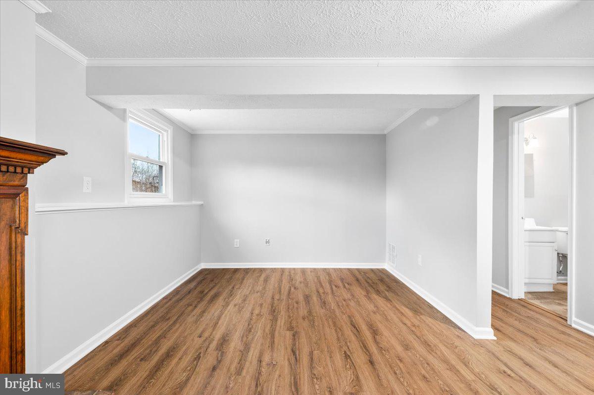 1489 Eden Drive Frederick, MD 21701 - Photo 29 of 43 a view of a room with wooden floor and white walls