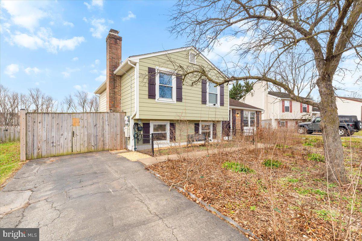 1489 Eden Drive Frederick, MD 21701 - Photo 3 of 43 a front view of a house with a yard and garage