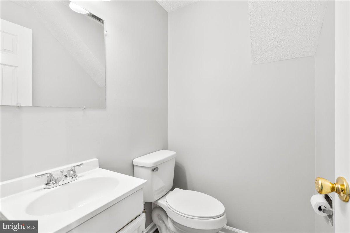 1489 Eden Drive Frederick, MD 21701 - Photo 31 of 43 a white toilet sitting next to a bathroom sink