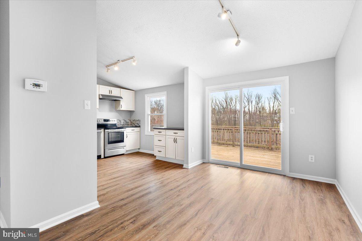1489 Eden Drive Frederick, MD 21701 - Photo 8 of 43 a view of a kitchen with refrigerator and wooden floor