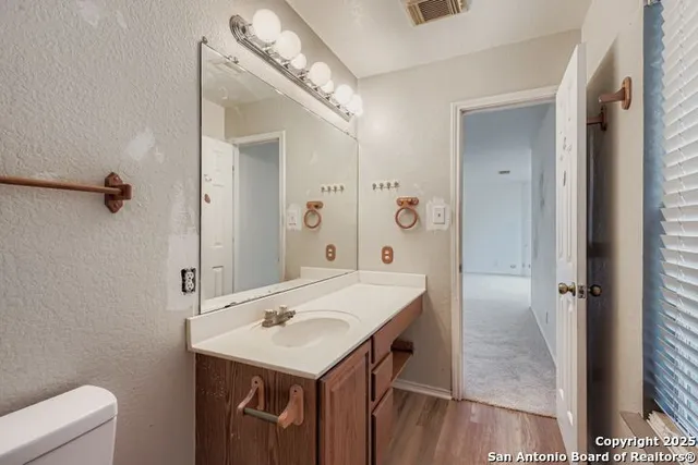 a bathroom with a sink a mirror and a shower