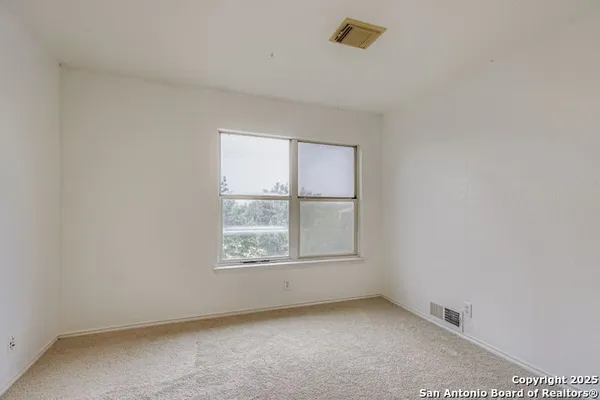 a room with furniture and a view of dining room