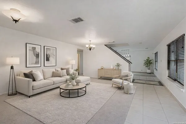 a living room with furniture and a large window