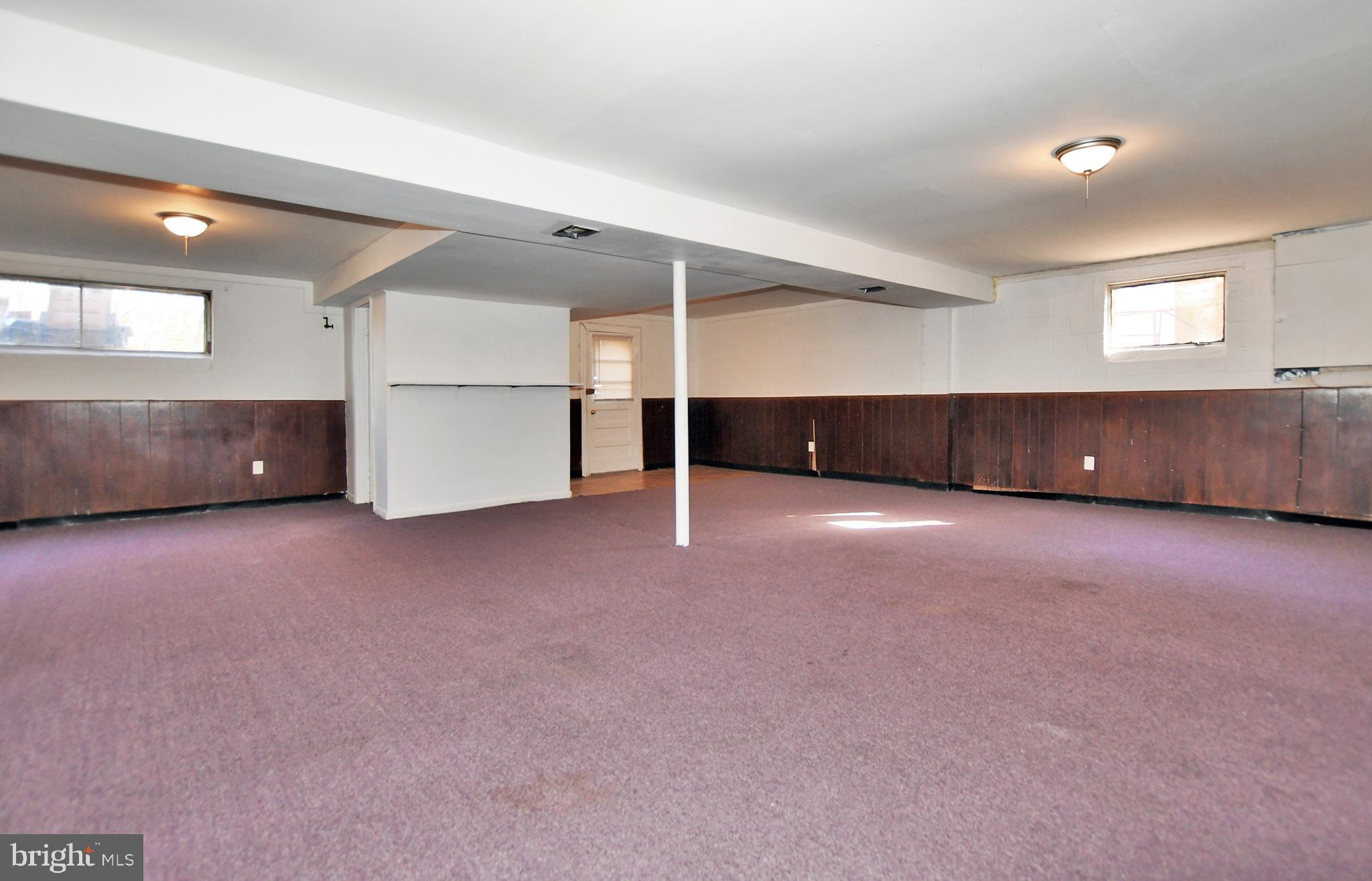 811 Whittington Terrace Silver Spring, MD 20901 - Photo 22 of 31 Large finished rec room area on lower level.