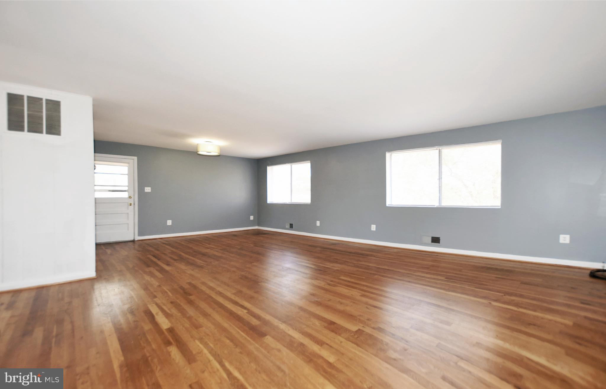 811 Whittington Terrace Silver Spring, MD 20901 - Photo 6 of 31 Large living room with hardwood floors.