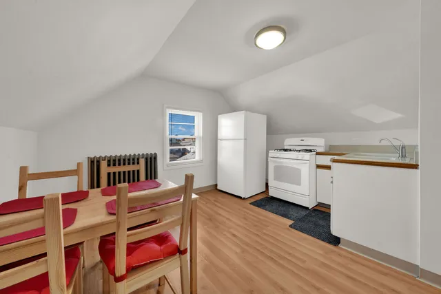 a very nice looking room with a bed and a cabinets