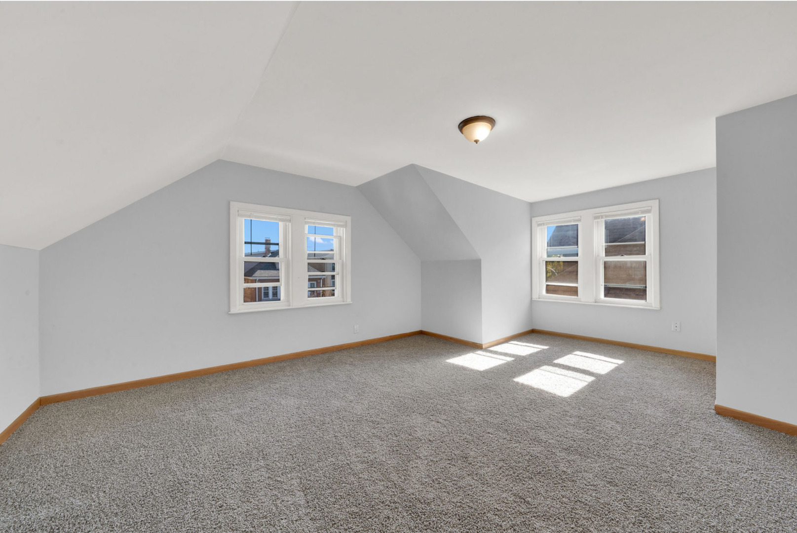 6238 South Massasoit Avenue, Unit 2 Chicago, IL 60638 - Photo 5 of 7 an empty room with windows