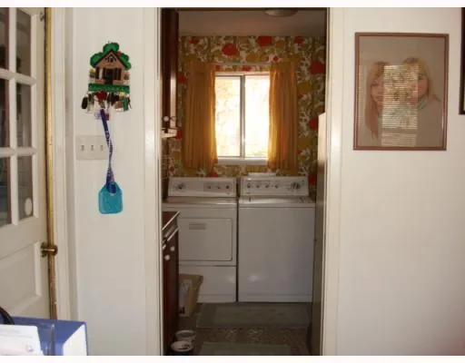 a view of hallway with wooden floor