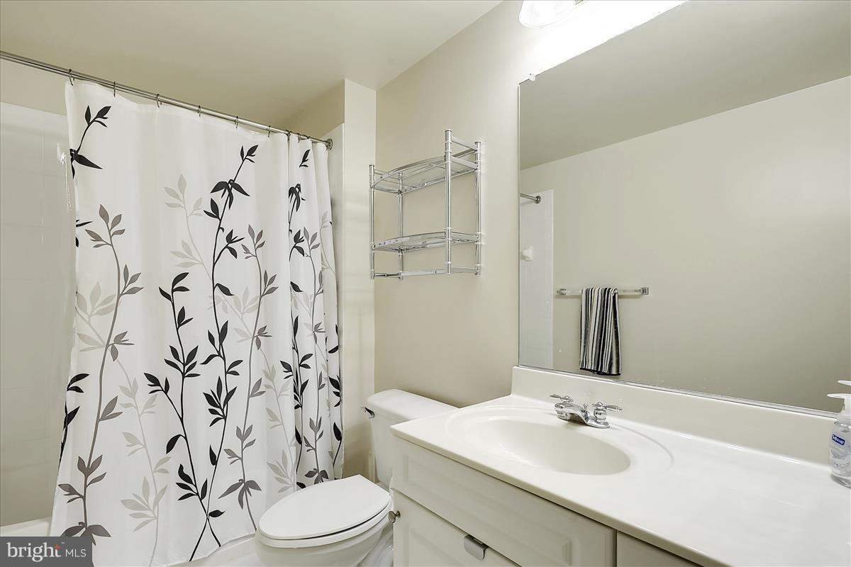 2726 Gallows Road, Unit 612 Vienna, VA 22180 - Photo 12 of 30 a bathroom with a sink toilet and shower