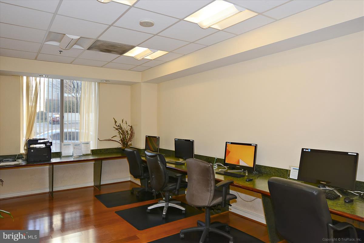 2726 Gallows Road, Unit 612 Vienna, VA 22180 - Photo 16 of 30 a view of a workspace with furniture and a window