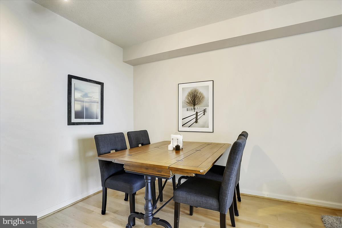 2726 Gallows Road, Unit 612 Vienna, VA 22180 - Photo 8 of 30 a view of a dining room with furniture