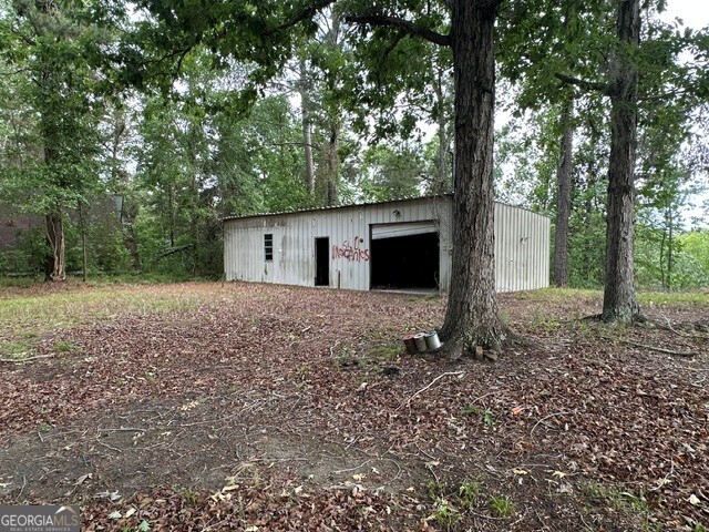 308 Three Rivers Lane Uvalda, GA 30473 - Photo 24 of 28 a view of a house with a yard