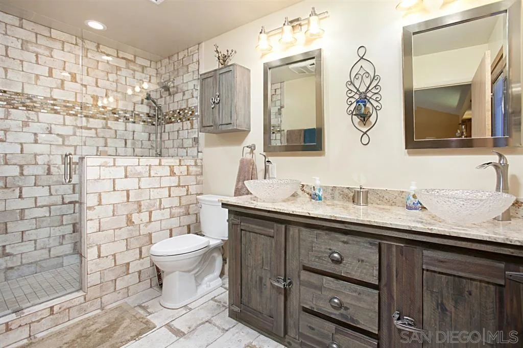 16987 Lyons Valley Road Jamul, CA 91935 - Photo 14 of 25 a bathroom with a toilet sink and mirror