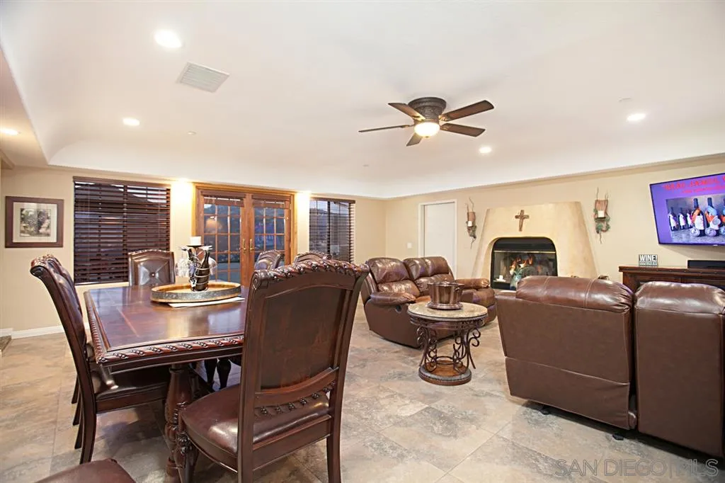 16987 Lyons Valley Road Jamul, CA 91935 - Photo 17 of 25 a living room with furniture a rug and a chandelier