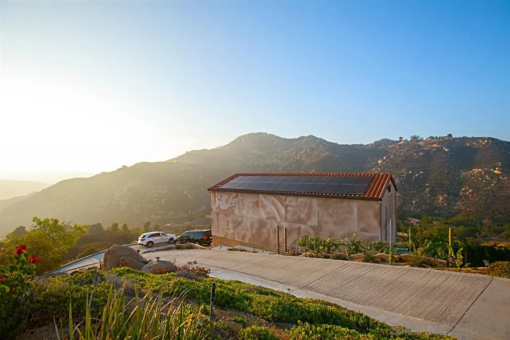 16987 Lyons Valley Road Jamul, CA 91935 - Photo 23 of 25 a view of a house with a yard and a garden