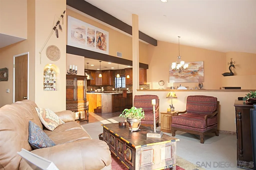 16987 Lyons Valley Road Jamul, CA 91935 - Photo 5 of 25 a living room with furniture and a kitchen area