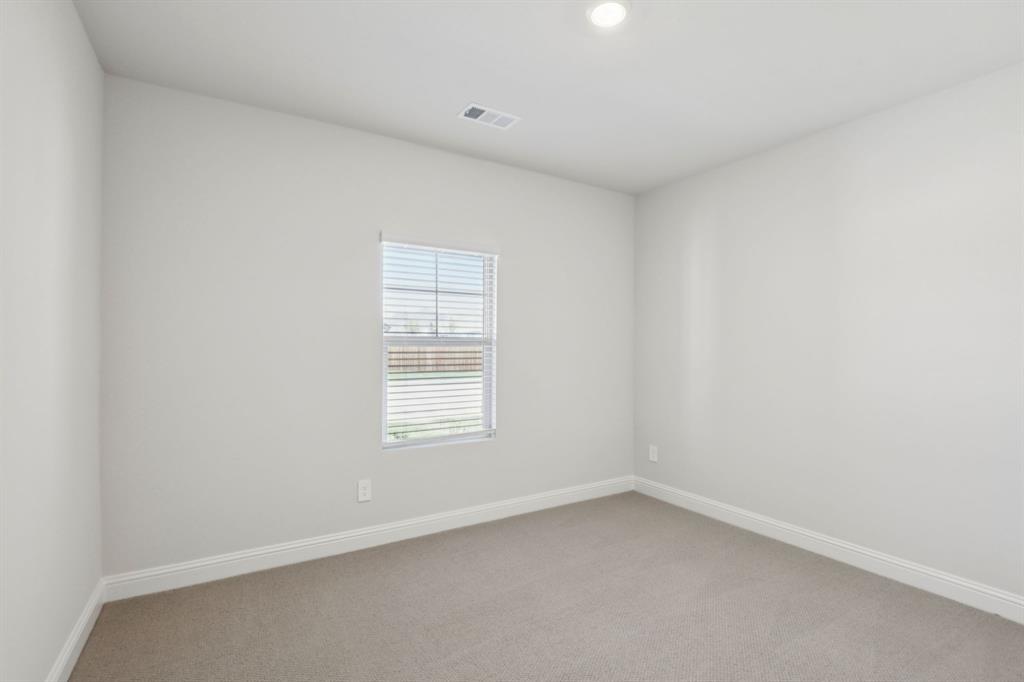 2206 Windy Trail Princeton, TX 75407 - Photo 24 of 34 an empty room with a window
