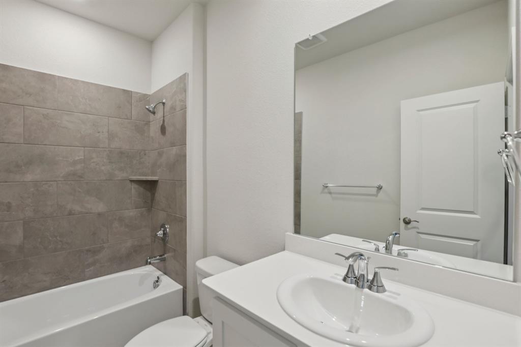 2206 Windy Trail Princeton, TX 75407 - Photo 25 of 34 a bathroom with a sink toilet and shower