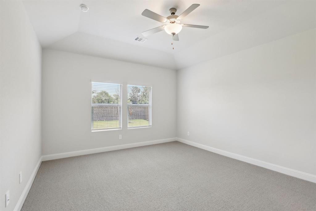 2206 Windy Trail Princeton, TX 75407 - Photo 27 of 34 an empty room with a window and a fan